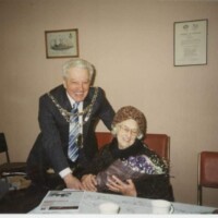 Otley Town's Mayor of the time presents Annie with a bouquet of flowers to mark her special return day to the area and to the former Clifton school and chapel.