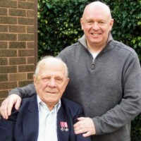 A wonderful moment of shared friendship between Romuald and Journalist Malcolm R Fane, pictured at his home in Gainsborough, Lincolnshire, England, during his final years.