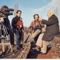 Filming interview with Romuald sat atop the scattered mounds of brick rubble within Auschwitz - the remnants of buildings blown up by retreating Nazi camp guards as WW11 ended.